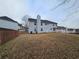 Large backyard with a privacy fence and mature trees at 4667 Derby Loop, Fairburn, GA 30213