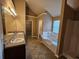 Bathroom features dual vanity sinks, tub, and separate shower creating a luxurious space to relax at 4667 Derby Loop, Fairburn, GA 30213