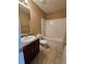 Full bathroom features a shower-tub combination, single sink vanity and tile flooring at 4667 Derby Loop, Fairburn, GA 30213