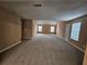 Upstairs bedroom has carpet flooring, natural light, and neutral paint providing a blank canvas at 4667 Derby Loop, Fairburn, GA 30213