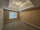 Bedroom with a large window and tray ceiling at 4667 Derby Loop, Fairburn, GA 30213