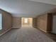 This bedroom offers a peaceful retreat with soft carpeting and neutral paint at 4667 Derby Loop, Fairburn, GA 30213