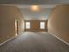 Large bedroom features natural lighting, carpet flooring, and neutral wall color at 4667 Derby Loop, Fairburn, GA 30213