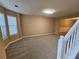Bright living room with carpet flooring and large windows offering abundant natural light at 4667 Derby Loop, Fairburn, GA 30213
