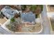 Overhead shot of the home, showcasing its roof, driveway, and landscaping in relation to the neighborhood street at 10440 Cranchester Way, Alpharetta, GA 30022