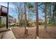 Backyard with a wooded area and homes visible at 10440 Cranchester Way, Alpharetta, GA 30022