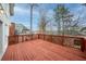 Large wooden deck overlooking a private backyard with mature trees, perfect for outdoor entertaining at 10440 Cranchester Way, Alpharetta, GA 30022