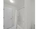 White bathroom with tub and shower, with a view of the vanity at 10440 Cranchester Way, Alpharetta, GA 30022