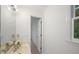 Bright bathroom vanity area featuring a white sink and a large mirror at 10440 Cranchester Way, Alpharetta, GA 30022