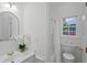 Well-lit bathroom with white vanity, decorative mirror, and classic fixtures at 10440 Cranchester Way, Alpharetta, GA 30022