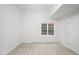 Bright bedroom with neutral carpet and a window with natural light at 10440 Cranchester Way, Alpharetta, GA 30022