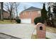 Home exterior view with a brick mailbox and attached two-car garage at 10440 Cranchester Way, Alpharetta, GA 30022