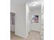 Bright hallway with tile flooring, white walls, closet, and a white paneled front door at 10440 Cranchester Way, Alpharetta, GA 30022