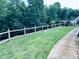 View of backyard featuring a wooden fence bordering the lawn at 3428 Stembler Rdg, Douglasville, GA 30135