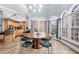 Open dining room featuring large windows, tile floors, and unique lighting fixture at 3428 Stembler Rdg, Douglasville, GA 30135