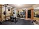 Bright exercise room with a weight rack, various machines, and a built-in sauna at 3428 Stembler Rdg, Douglasville, GA 30135