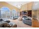 Inviting living room featuring built-in shelving, a fireplace, and large windows bringing the outside in at 3428 Stembler Rdg, Douglasville, GA 30135