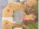 Drone's eye view of home and outdoor entertaining space with firepit and stone walkway at 1050 Silver Thorne Dr, Loganville, GA 30052