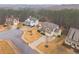 Aerial view of a two-story home showcasing the landscape, surrounding neighborhood and quiet cul-de-sac at 1050 Silver Thorne Dr, Loganville, GA 30052