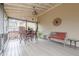 Relaxing covered back porch featuring bench seating and a ceiling fan at 1050 Silver Thorne Dr, Loganville, GA 30052