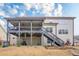 Two story home showcasing a spacious two-level deck and walk out basement at 1050 Silver Thorne Dr, Loganville, GA 30052