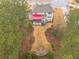 Expansive backyard featuring a stone pathway leading to a fire pit with seating at 1050 Silver Thorne Dr, Loganville, GA 30052