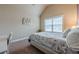 Neutral bedroom with carpet flooring, and a large window at 1050 Silver Thorne Dr, Loganville, GA 30052