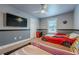 This bedroom features race car beds and a TV at 1050 Silver Thorne Dr, Loganville, GA 30052