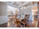 Dining room with a view into office area, hardwood floors, and large table for gatherings at 1050 Silver Thorne Dr, Loganville, GA 30052