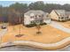 Charming two-story home with landscaped yard, manicured lawn, and a two-car garage at 1050 Silver Thorne Dr, Loganville, GA 30052