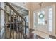 Inviting foyer featuring hardwood floors, a decorative wreath, and stairway to the second floor at 1050 Silver Thorne Dr, Loganville, GA 30052