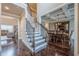 Open foyer with hardwood floors, staircase, and dining room, perfect for entertaining at 1050 Silver Thorne Dr, Loganville, GA 30052