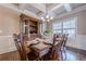 Inviting foyer with hardwood floors, staircase, coffered ceiling and dining room at 1050 Silver Thorne Dr, Loganville, GA 30052