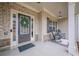 Charming front porch with brick accents and cozy rocking chairs for relaxing afternoons at 1050 Silver Thorne Dr, Loganville, GA 30052