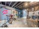 This basement gym includes a stationary bike, weights, and fitness gear, perfect for workouts at 1050 Silver Thorne Dr, Loganville, GA 30052