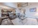 Open living room with a view of the kitchen, featuring a loft and dark hardwood floors at 1050 Silver Thorne Dr, Loganville, GA 30052