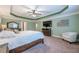This main bedroom features a trey ceiling, furniture, and a large plush bed at 1050 Silver Thorne Dr, Loganville, GA 30052