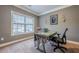 Well-lit office space with a large window, neutral paint, and comfortable carpeting at 1050 Silver Thorne Dr, Loganville, GA 30052