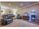 This theater room features plush seating, a popcorn machine, and recessed lighting for the ultimate viewing experience at 1050 Silver Thorne Dr, Loganville, GA 30052