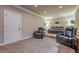 Cozy theater room features comfortable reclining chairs and a tiered platform for optimal viewing at 1050 Silver Thorne Dr, Loganville, GA 30052