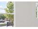 View from inside the home of the tree-lined street outside the large window at 122 Asland Ln # 26, Hapeville, GA 30354