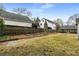 Large backyard with fencing, a green shed, and lush grass at 816 3Rd Ave, Decatur, GA 30030