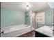 Bright bathroom featuring a soaking tub, walk-in shower, and vanity at 816 3Rd Ave, Decatur, GA 30030