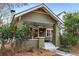 Inviting craftsman-style home featuring a cozy front porch with brick supports and well-kept landscaping at 816 3Rd Ave, Decatur, GA 30030