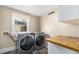 Laundry room with modern washer and dryer units, and natural light at 816 3Rd Ave, Decatur, GA 30030