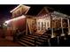 Inviting back deck with string lights, cozy seating, and lush greenery, perfect for outdoor entertaining at 1210 Thistle Gate Path, Lawrenceville, GA 30045