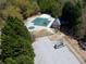 Aerial view featuring community pool and playground near a parking area and a vehicle at 3641 Willow Club Dr, Loganville, GA 30052