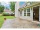 Back patio boasts a serene outdoor space with windows showcasing the bright interior of the home at 3641 Willow Club Dr, Loganville, GA 30052