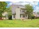 Back of home featuring a spacious yard and traditional siding, all under a partly cloudy sky at 3641 Willow Club Dr, Loganville, GA 30052