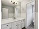 Bright bathroom features a large vanity, mirror, and great lighting at 3641 Willow Club Dr, Loganville, GA 30052